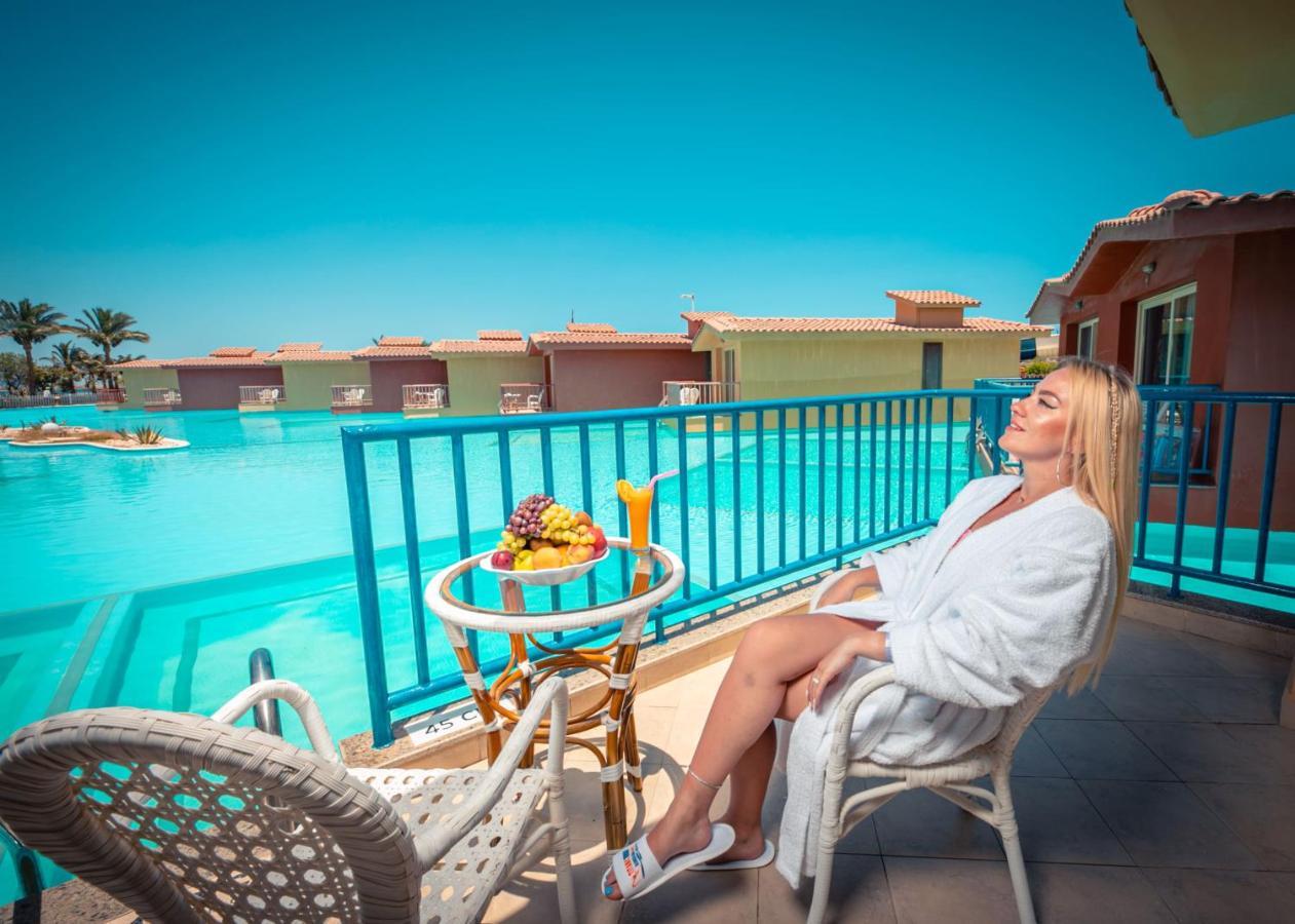 Titanic Palace Families And Couples Only Hurghada Bagian luar foto A woman relaxing at a resort